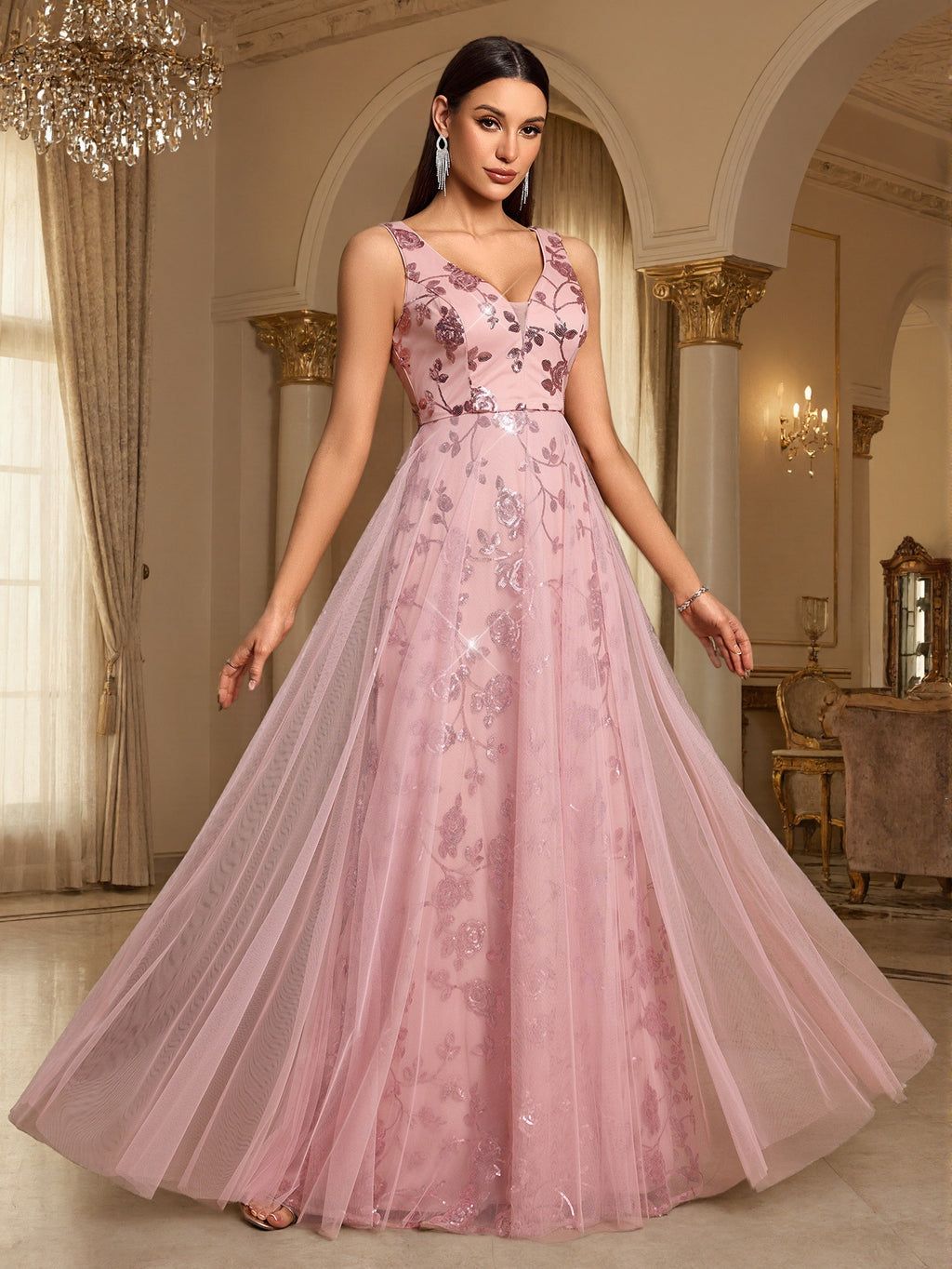 Pink sleeveless sequin evening dress with V-neck, fitted waist, and layered full skirt.