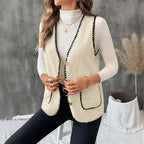 Women’s sleeveless wool vest coat in apricot with black trim and patch pockets