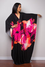 Black beach dress one-piece swimwear with bright pink floral print and flowing sleeves