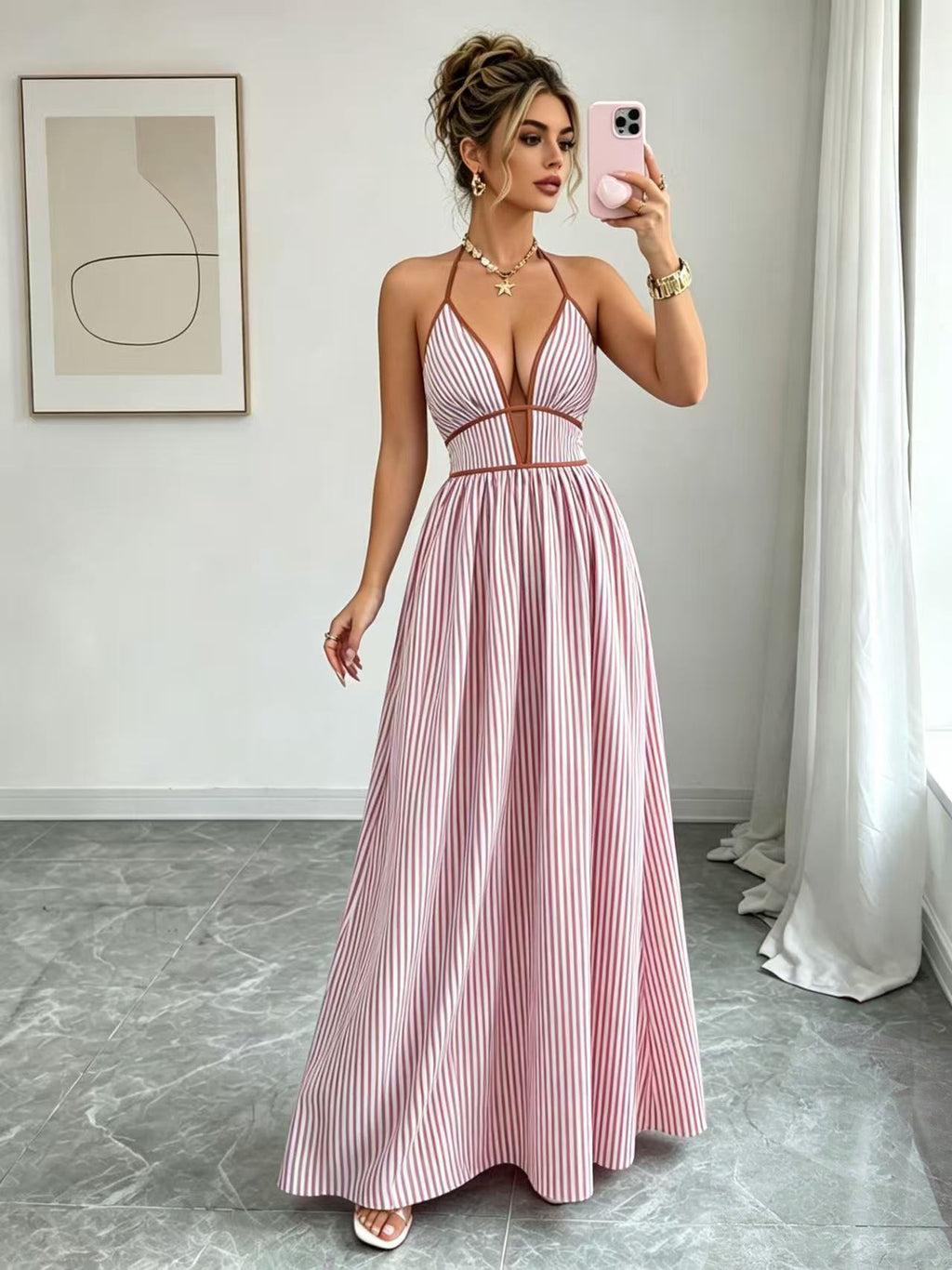 Pink striped halter maxi dress with V-neck and full flowing skirt