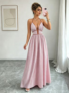 Pink striped halter maxi dress with V-neck and full flowing skirt