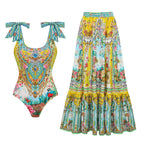 One-piece swimsuit and long swim skirt in bright yellow and teal ornate floral paisley print