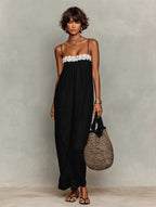 Black lace-trim maxi sling dress with spaghetti straps and textured lace yoke