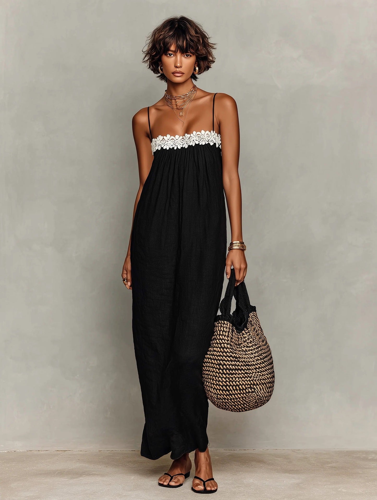 Black lace-trim maxi sling dress with spaghetti straps and textured lace yoke