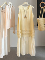 Yellow sleeveless summer dress with embroidered hem and tiered skirt