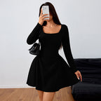 Black summer dress with square neckline, long sleeves, fitted waist, flared skater skirt