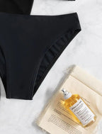 Black high-waist bikini bottom with smooth sides and stitched trim