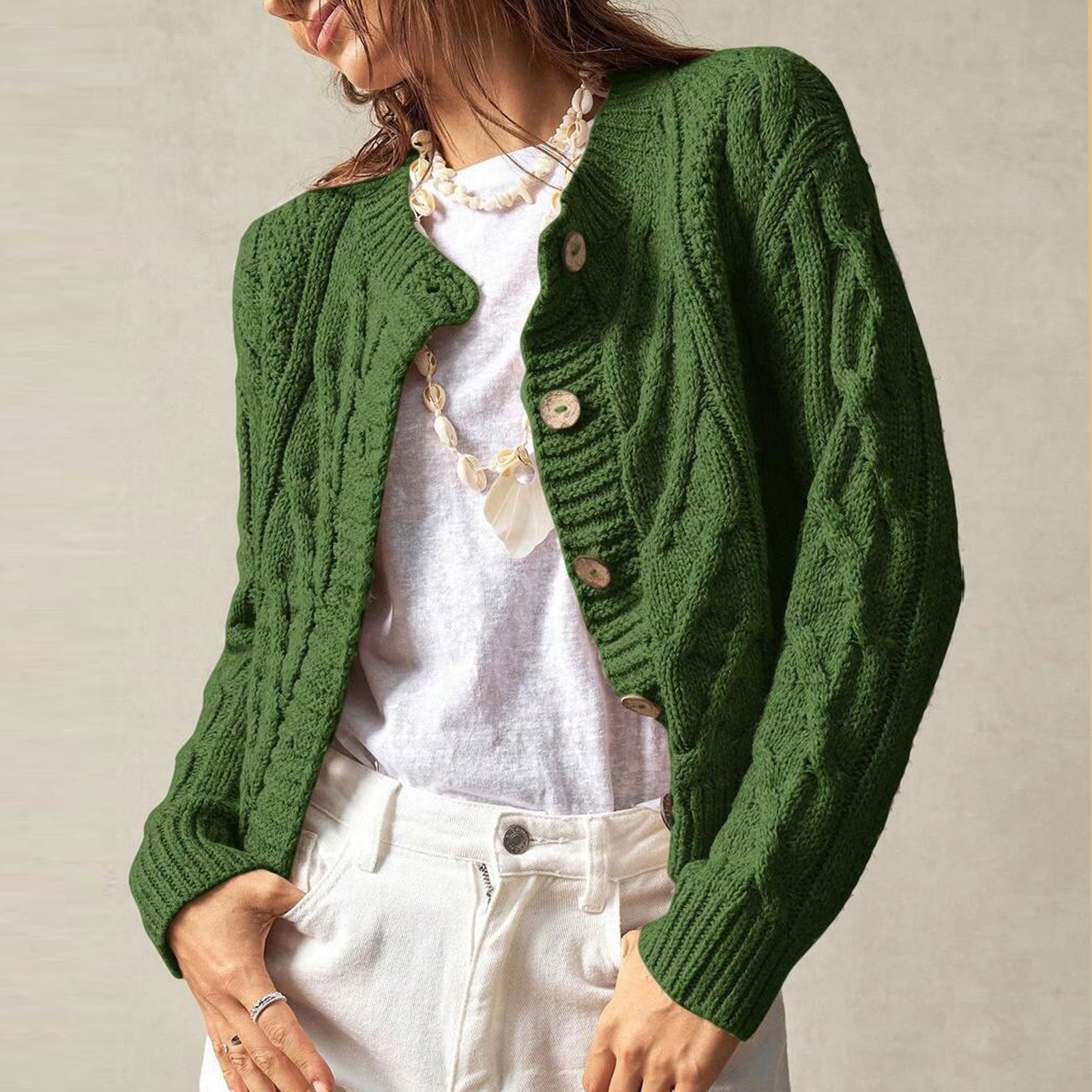 Green twist-knit cropped cardigan with round neck, button front, long sleeves