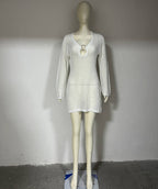 Long sleeve spring dress in white open knit with scoop neck and ringed keyhole cutout