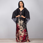 One-piece beach swim dress with V-neck, draped sleeves, and black floral scroll print