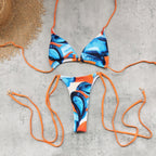 Multi-color printed string one-piece swimsuit, triangle cups and matching bottom