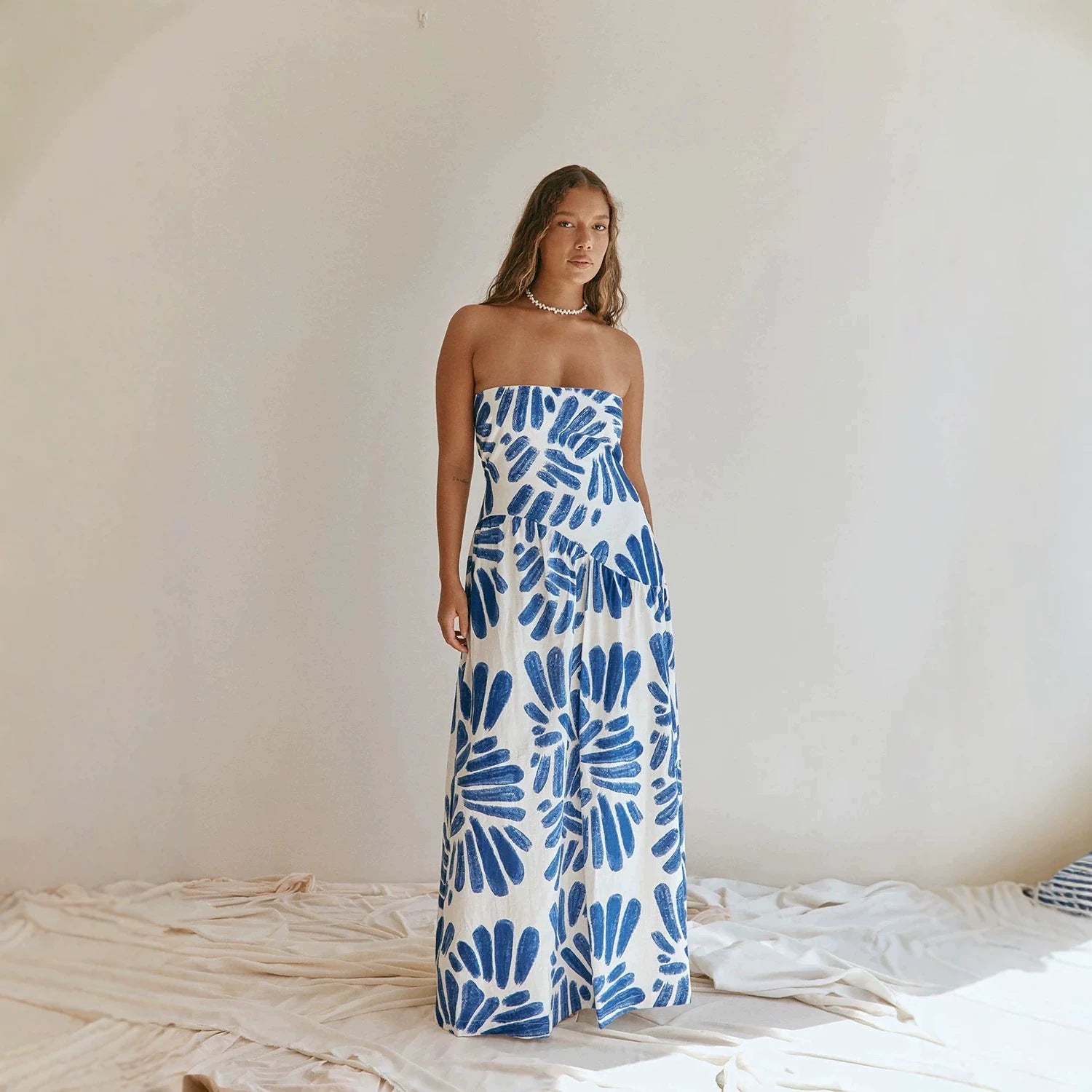 Strapless maxi dress with blue and white abstract floral tie-dye print, straight hem