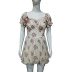 Floral lace mini dress on mannequin, puff sleeves, square neckline, cinched waist, cream