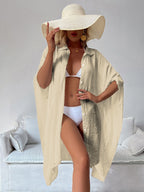 Cream-beige bamboo cotton cover-up shirt with collar, button front, and flowing wide sleeves.