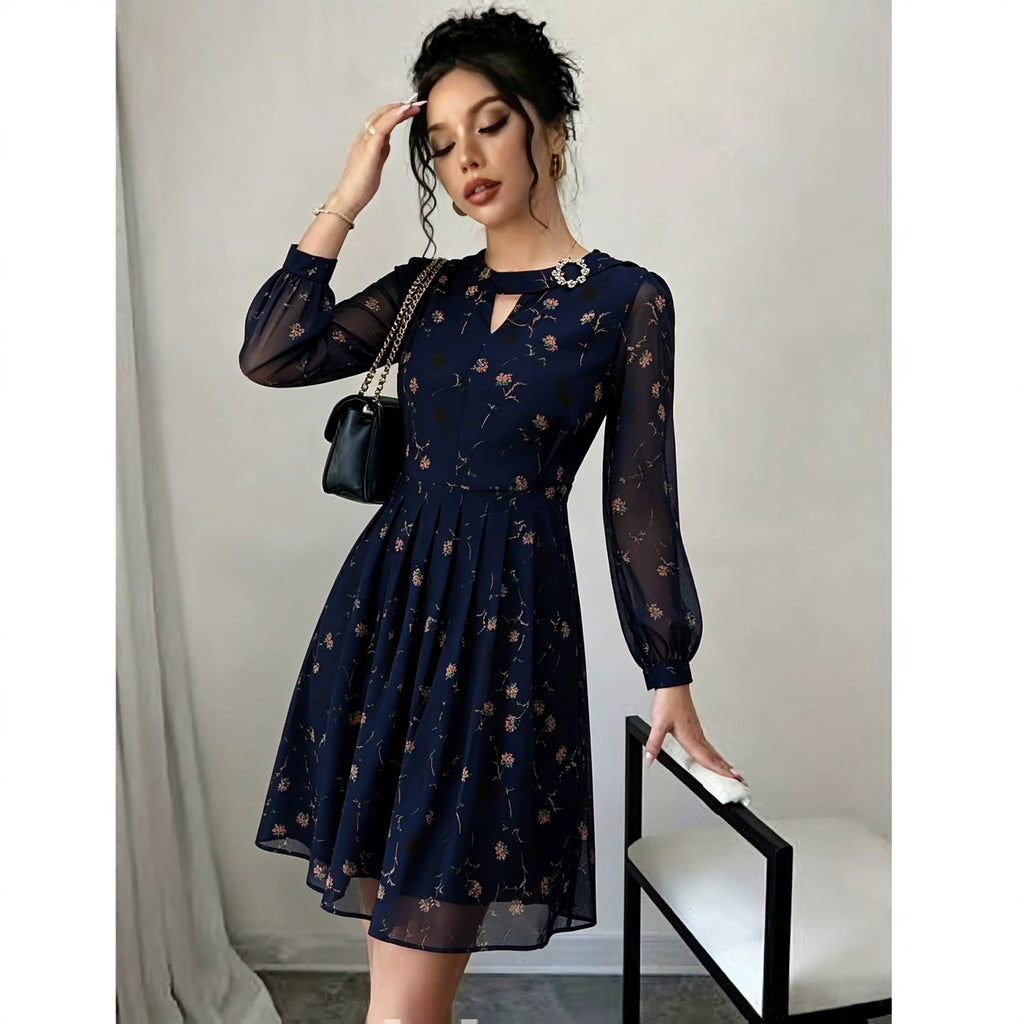 Navy chiffon long-sleeve dress with floral print, gathered waist, sheer puff sleeves