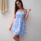 Sky-blue ruffled mini summer dress with spaghetti straps and square neckline.