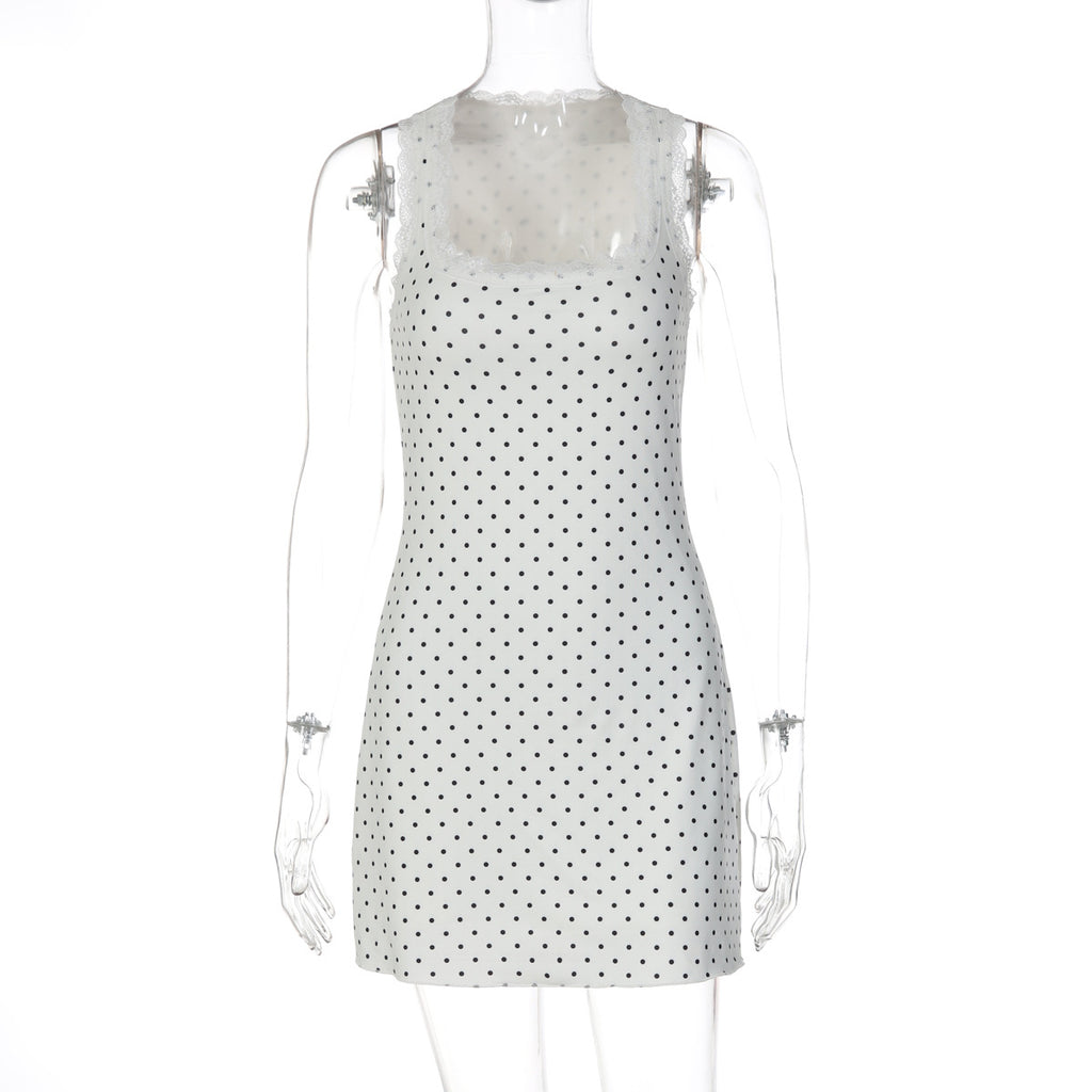 White lace bodycon mini dress on mannequin with scalloped neckline and dark dot print