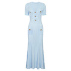 Light blue maxi short sleeve dress with ribbed texture, decorative button details and patch pockets
