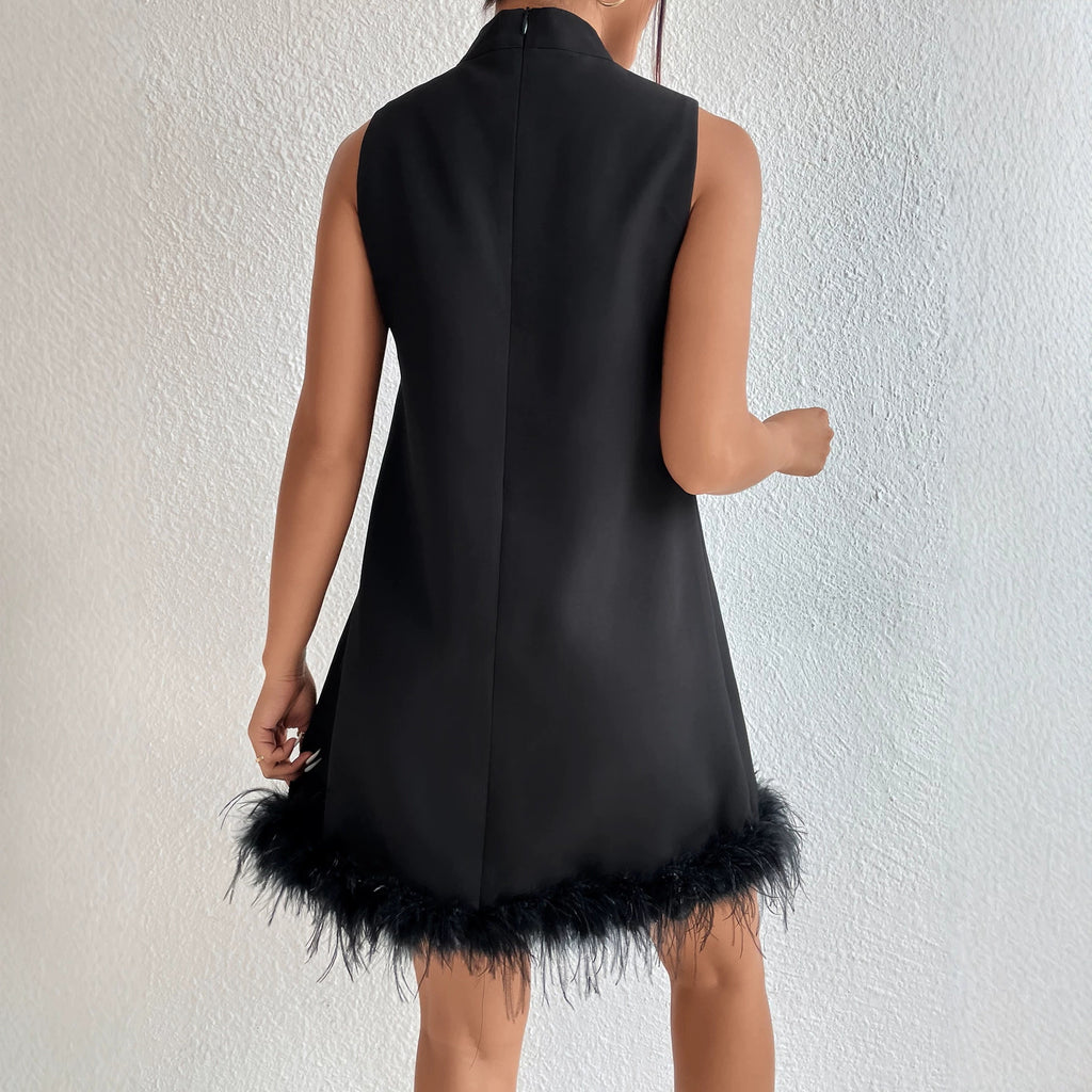 Black sleeveless half-turtleneck dress, A-line shape with feather-frayed hem