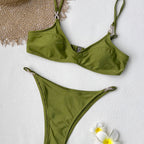 Green bikini top with thin straps and matching high-cut bottom
