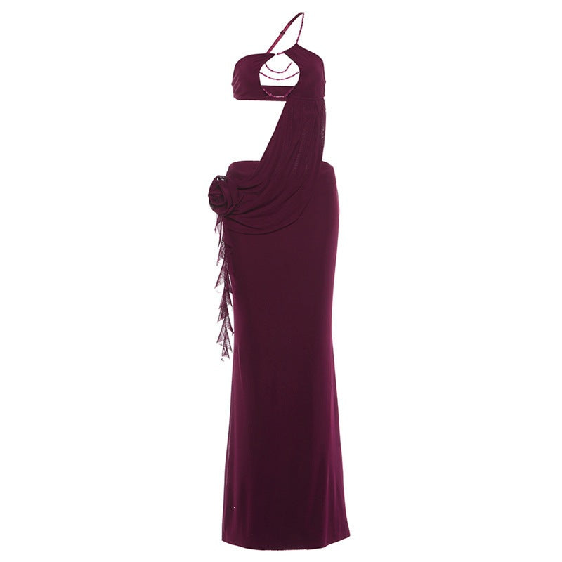 Burgundy halter maxi dress on mannequin with draped back and hanging side tassels