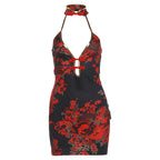 Backless halter mini dress front view, black with red floral print and gold detail