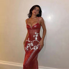 Red sequin maxi dress on thin straps with V-neck, white motif across bodice and skirt