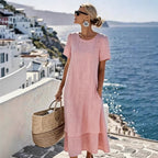 Pink boho short-sleeve dress with round neck, loose midi hem and layered skirt