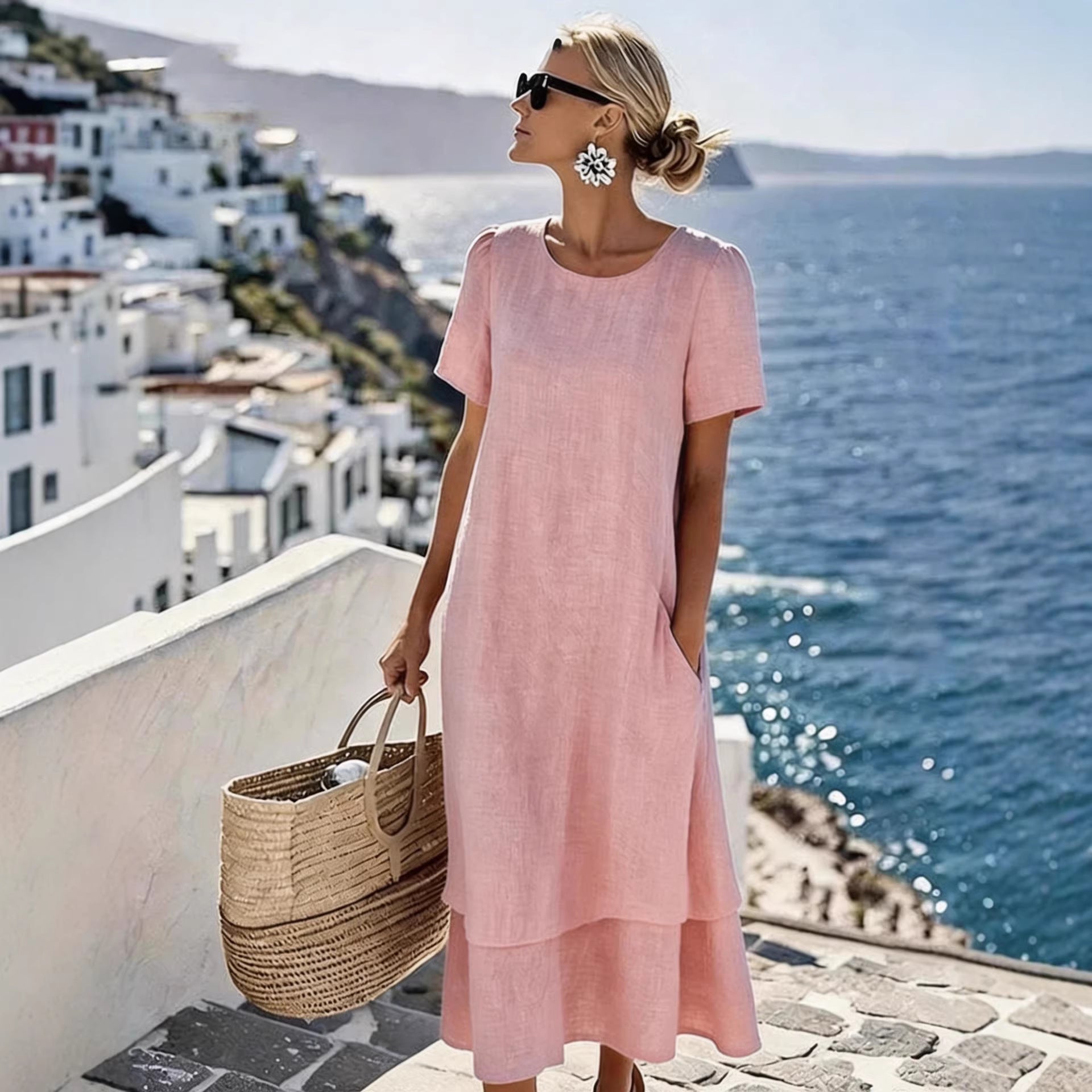 Pink boho short-sleeve dress with round neck, loose midi hem and layered skirt