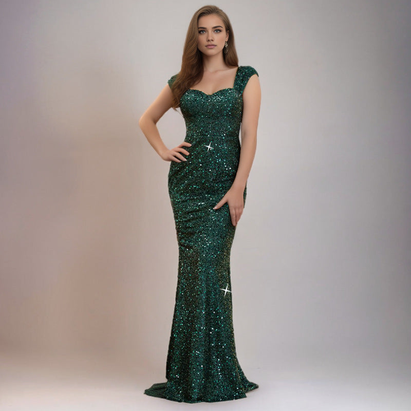 Green sequin sling dress with sweetheart neckline and fitted mermaid silhouette