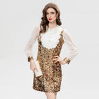 Gold sequin long-sleeve mini dress with sheer lace sleeves and buttoned collar