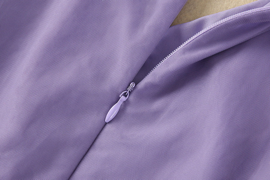 Purple tulle dress with front zip closure and smooth sheer fabric