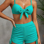 Women's turquoise bow-front bikini set with shorts