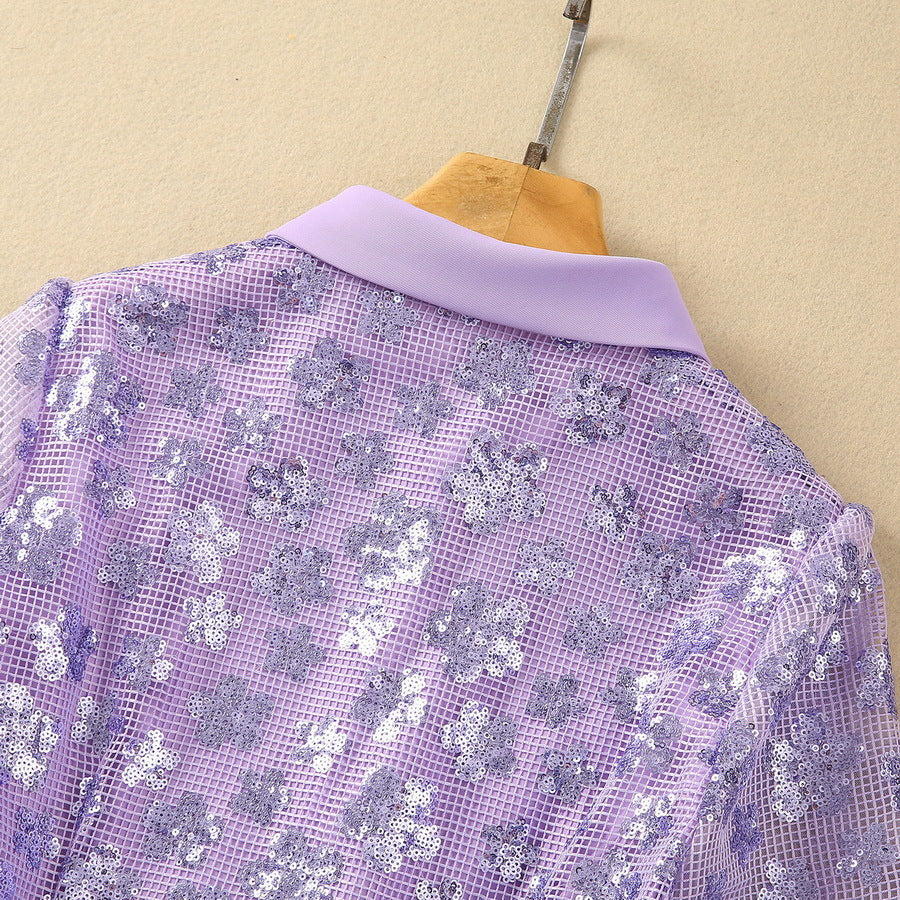 Lavender sequin fabric close-up from the back with point collar on hanger