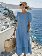 Blue boho short-sleeve dress with round neck, loose midi hem and tiered look