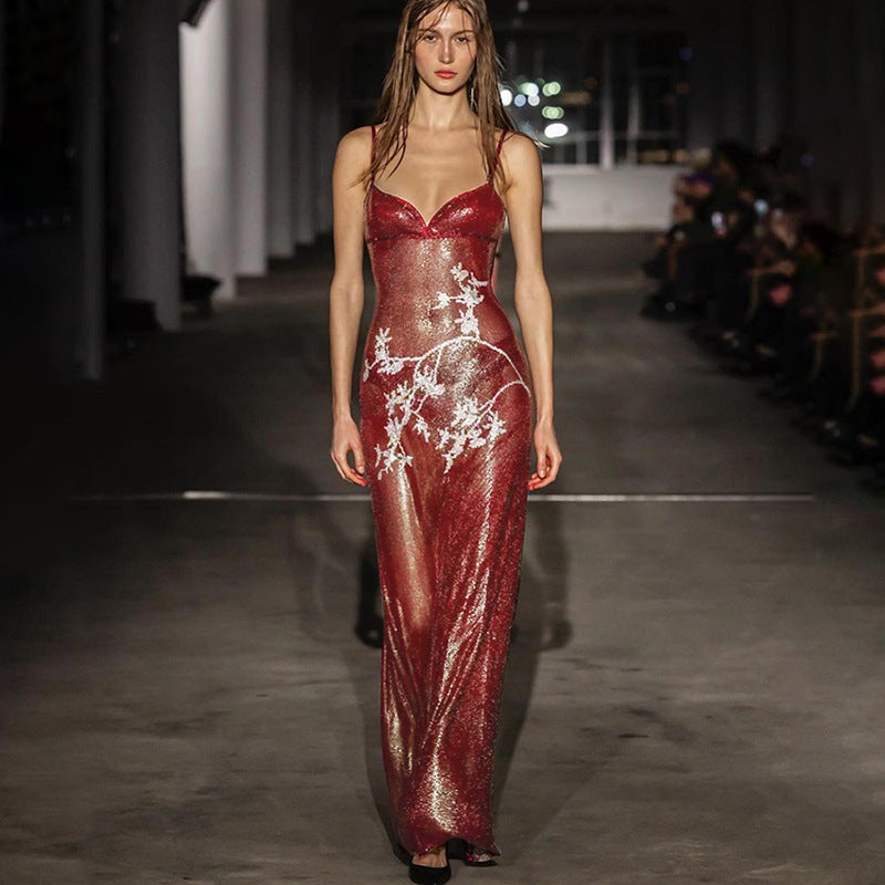Red sequin maxi dress with spaghetti straps, V-neck, fitted column, white reindeer pattern