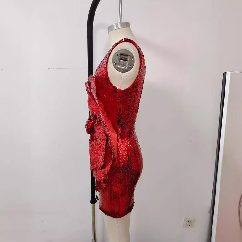 Red sequin sheath dress on mannequin with rose applique and sleeveless cut