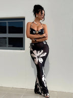 Black halter bikini with white floral print and matching long skirt