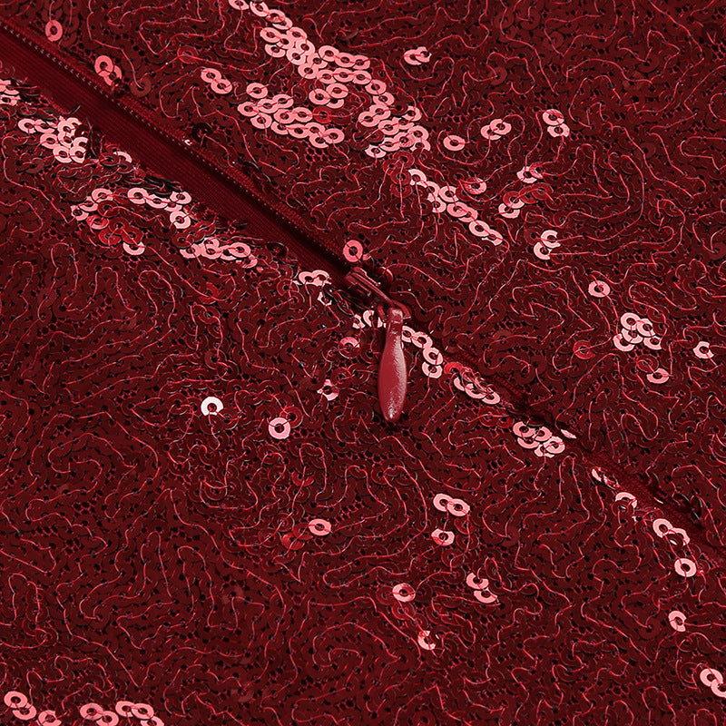 Close-up of red sequin fabric with reflective round sequins pattern