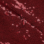 Close-up of red sequin fabric with reflective round sequins pattern