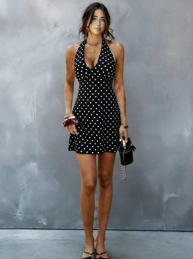 Black halter V-neck mini dress with white polka dots, front view