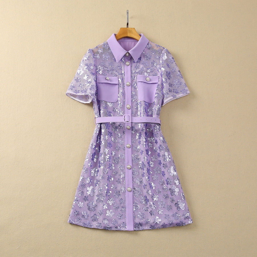 Lavender sequin short sleeve dress on hanger with point collar, pockets, and belt