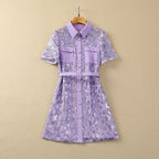 Lavender sequin short sleeve dress on hanger with point collar, pockets, and belt