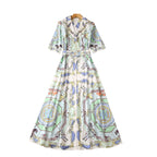 Women's sequin short-sleeve midi dress, illustrated pastel print with full skirt and belt ties.