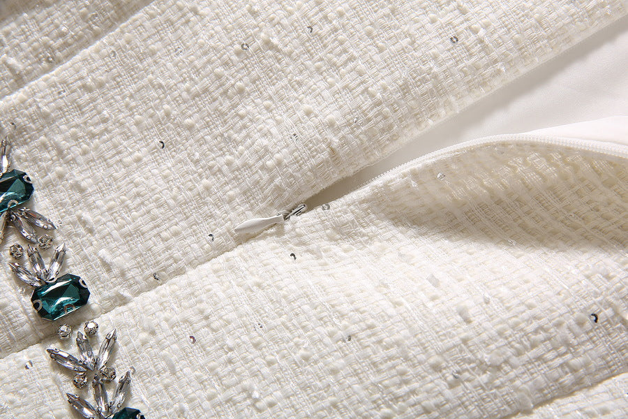Beige textured sequin fabric with visible side zipper opening