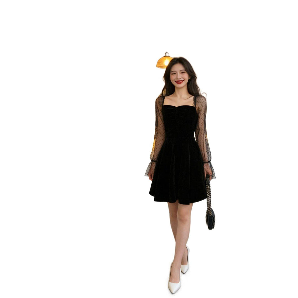 Women's black A-line chiffon dress with sheer polka-dot sleeves and flared skirt