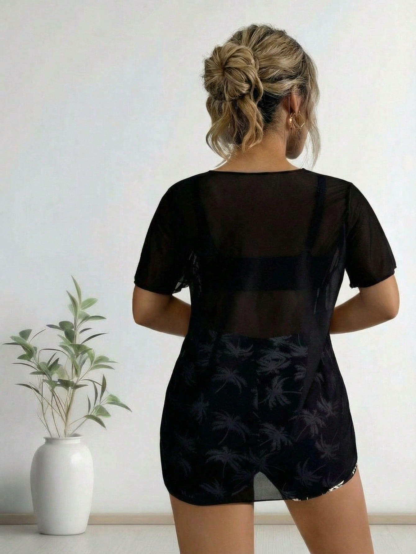 Black swim cover-up with sheer back and matching shorts, palm print