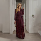 Wine red sequin maxi dress with V-neck, long sleeves, and front leg slit
